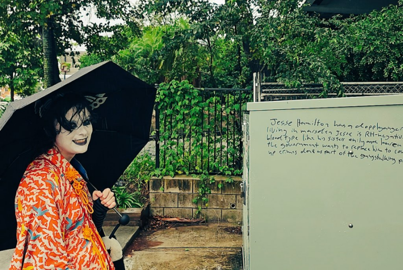 Grinning in front of some insane graffiti.